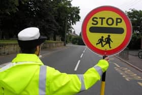 School crossing patrols could be put at risk as a result of measures by Hampshire County Council to save money. Picture for illustrative purposes only