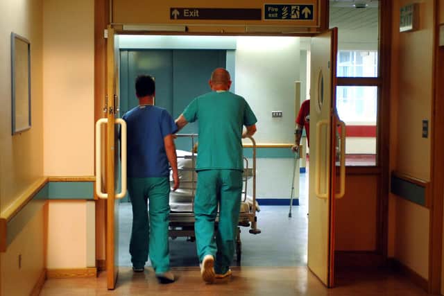 Orderlies push bed, Royal Orthopedic Hospital, Oswestry. Picture David Jones/PA