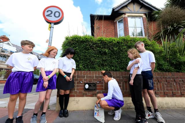 Children from Wimborne Primary School. From left: Charlie Morgan (11), Elsa Roberts (11), Anna Montazeralaih (11), Chandler Killick (10), Lily Bovill (11), and Josh Clements (11), at the unveiling of a plaque in memory of their beloved lollipop man, Tom James, on the corner of Wimborne Road and Winter Road, Southsea. Picture: Chris Moorhouse (jpns 270622-)