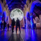 People looking at the Museum of The Moon installation at St Marys Church, Fratton, Portsmouth
Picture: Habibur Rahman