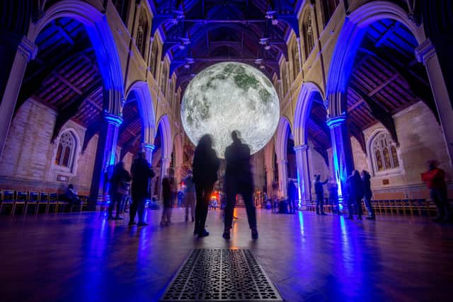 People looking at the Museum of The Moon installation at St Marys Church, Fratton, Portsmouth
Picture: Habibur Rahman