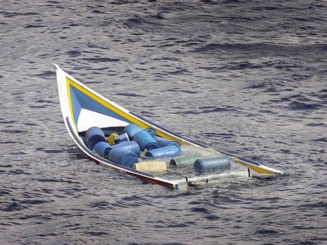 A 'go-fast' speed takes on water after being intercepted by HMS Dauntless during a narcotics bust in the Eastern Caribbean.