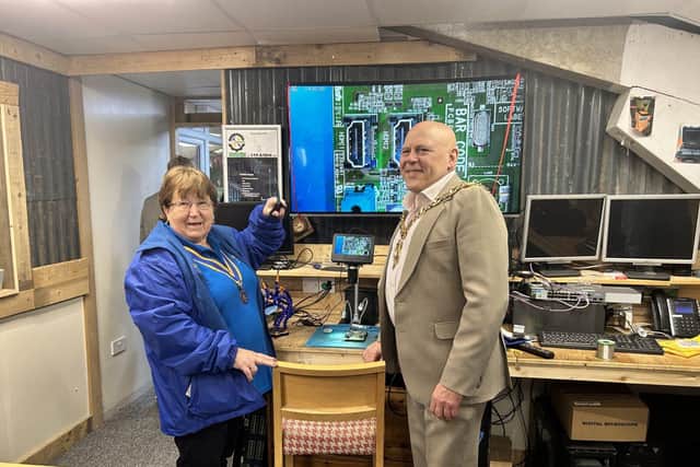 Lesley Brunink and Gosport Mayor Cllr Martin Pepper unveil the new microscope.