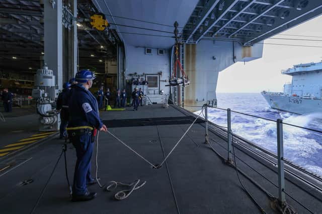 HMS Queen Elizabeth crew undertake a delicate rearmament operation. Picture: Royal Navy