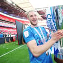 Matt Clarke toasts Pompey's Checkatrade Trophy triumph. Picture: Joe Pepler