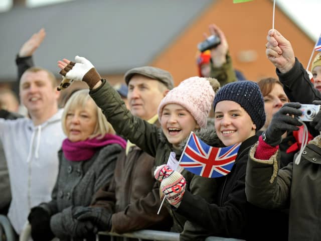 22nd November 2013.  Families and well wishers welcome the Royal Navy destroyer HMS Dragon back to Portsmouth following her recent deployment to The Indian Ocean and The Mediterranean. Picture: Ian Hargreaves  (133207-6)