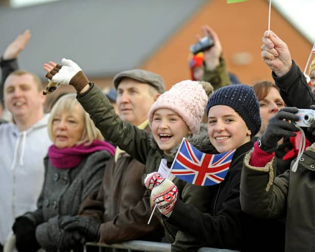 22nd November 2013.  Families and well wishers welcome the Royal Navy destroyer HMS Dragon back to Portsmouth following her recent deployment to The Indian Ocean and The Mediterranean. Picture: Ian Hargreaves  (133207-6)