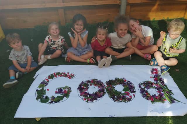Children at Tops Nursery celebrate after their 'Good' Ofsted rating.