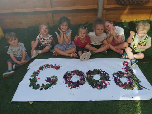 Children at Tops Nursery celebrate after their 'Good' Ofsted rating. 