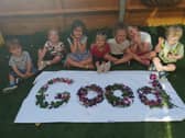 Children at Tops Nursery celebrate after their 'Good' Ofsted rating. 