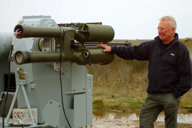 Hugh examining an electronic warfare system.