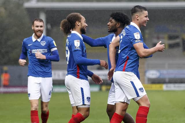 Pompey celebrate their fourth goal at Burton. Picture: Daniel Chesterton/phcimages.com