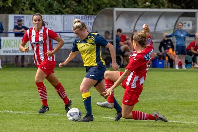 Beth Burgess is tackled by Exeter's Jaydee Seaman. Picture: Mike Cooter
