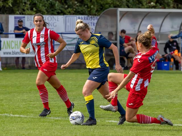 Beth Burgess is tackled by Exeter's Jaydee Seaman. Picture: Mike Cooter