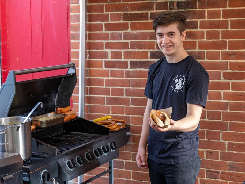 Reese Gilfillan (18) kept visitors supplied with traditional bratwurst and pretzels at the Powder Monkey event.Picture: Mike Cooter (011023)