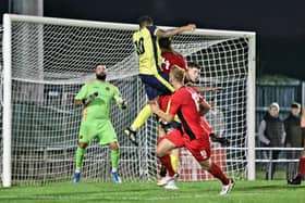 Theo Lewis heads Gosport into a first half lead against Winchester. Picture: Tom Phillips