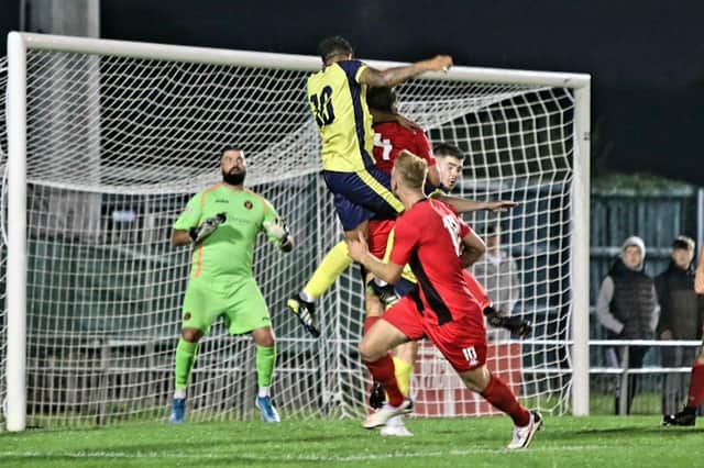 Theo Lewis heads Gosport into a first half lead against Winchester. Picture: Tom Phillips