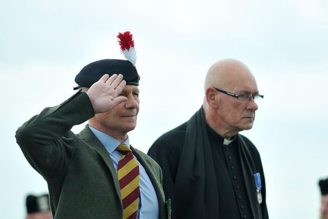 Dave McKenna and ex-army Chaplin Father Kennedy paying their respects during The Last Post.