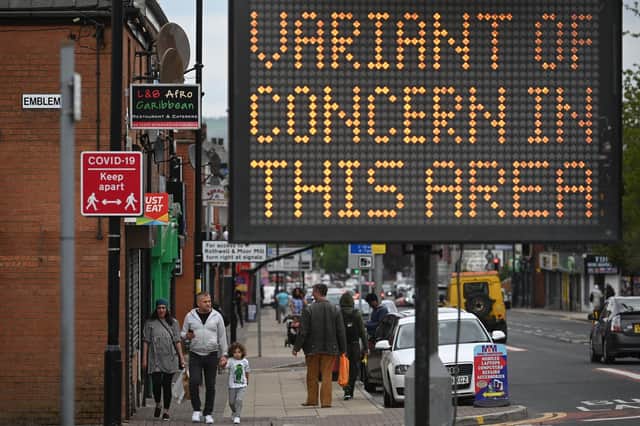A public health digital board warns the public of a Covid-19 variant of concern affecting the community in Bolton, northwest England on May 14, 2021. Picture: Getty Images.
