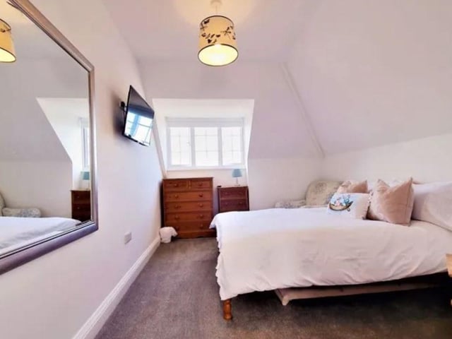 This home is extremely unique and it is detached.