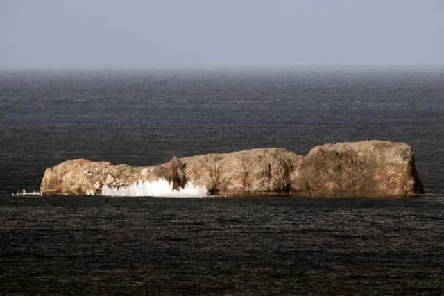 Another 500lb laser-guided bomb exploding as it hits small island off the Scottish coast. Photo: Royal Navy