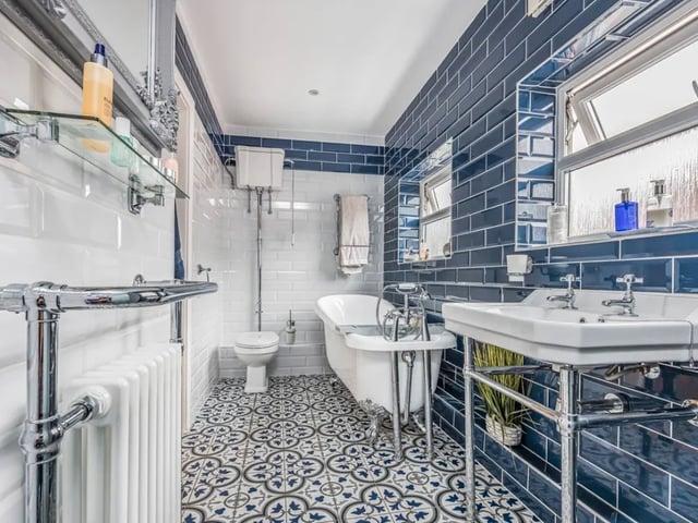 The listing says: "Easily one of the most surprising, deceiving and fantastic homes I’ve ever listed... This extended four bedroom detached chalet home, occupies a plot and a half, with the current owners having brought an additional garden... Creating the party space and garden of dreams."
