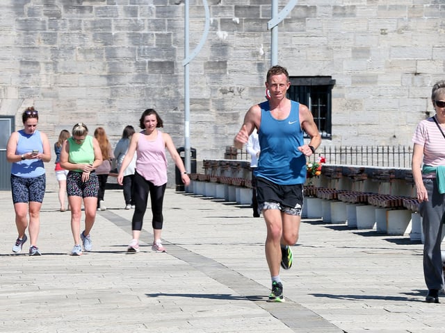 Runner at the Square Tower, Old Portsmouth. Picture: Chris  Moorhouse (250524-01)