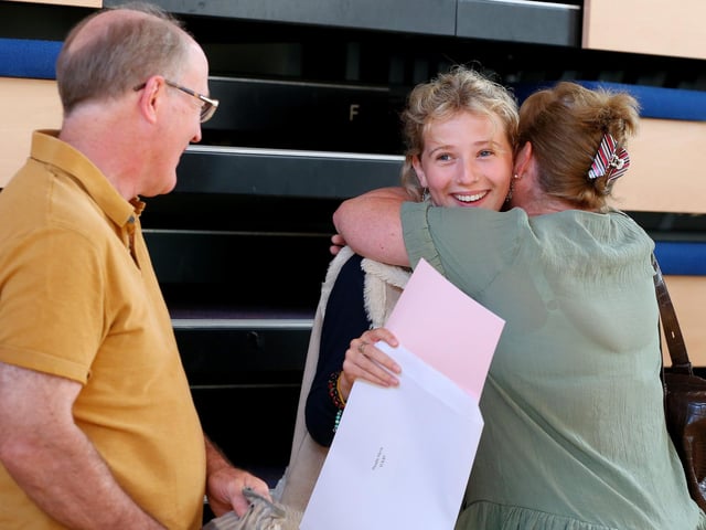 Phoebe Harris is congratulated by her parents Tracy and Ian at Portsmouth High School, Southsea
Picture: Chris Moorhouse (jpns 180822-01)