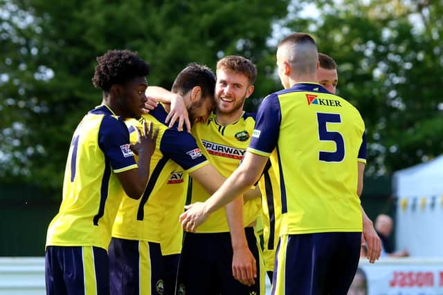 Matt Paterson, second left, gets a hug from team-mate Harvey Rew, third left, after grabbing what proved to be Gosport's winner at Yate Town Picture: Tom Phillips