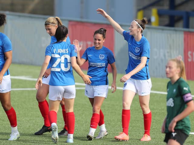 Four-goal debutant hero Cherelle Khassal, centre, is congratulated by her Pompey Women team-mates. Pictures: Dave Haines and Lily Moore