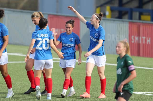 Four-goal debutant hero Cherelle Khassal, centre, is congratulated by her Pompey Women team-mates. Pictures: Dave Haines and Lily Moore