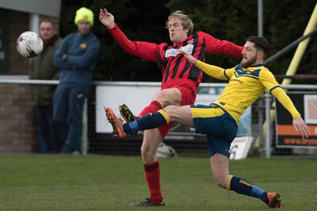 Flashback to January 2017 and one of Pete Stiles' first games as Fareham boss - a 2-2 draw at Moneyfields. Simon Woods (Fareham, red) battles for possession with Tyler Giddings. Picture: Keith Woodland.