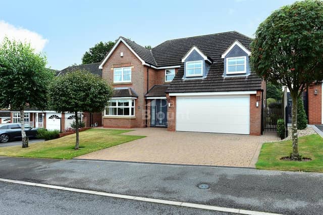 The stunning exterior of the Mayflower Court property. The block-paved driveway leads to a huge double garage, while the front door is made of contemporary steel.