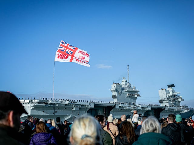 More than 2,000 friends and family gathered to watch the warship sail past the jetty.