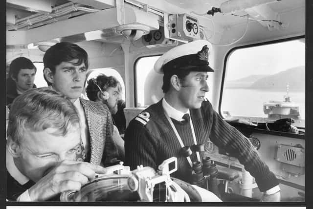 Prince Charles, Captain of HMS Bronington, watched by brother Prince Andrew