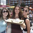 Emma Vaughan, Amy Crook and Libby Pearson looking forward to tucking into some oysters from the Riddle & Finns champagne and oyster stall.  Picture: Sarah Standing (010825-7944)