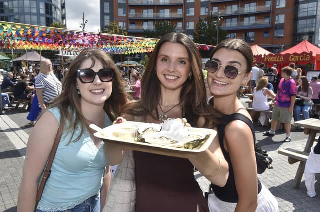 Emma Vaughan, Amy Crook and Libby Pearson looking forward to tucking into some oysters from the Riddle & Finns champagne and oyster stall. Picture: Sarah Standing (010825-7944)