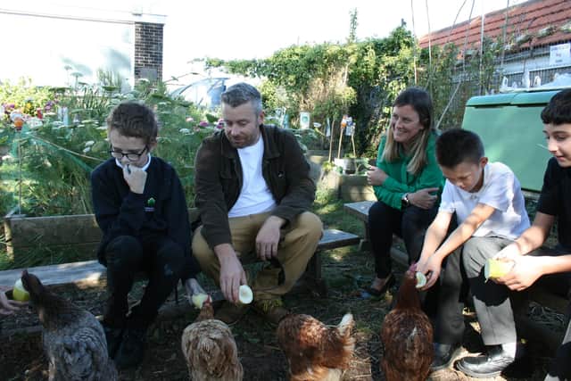 Staff and students in the garden at Redwood Park