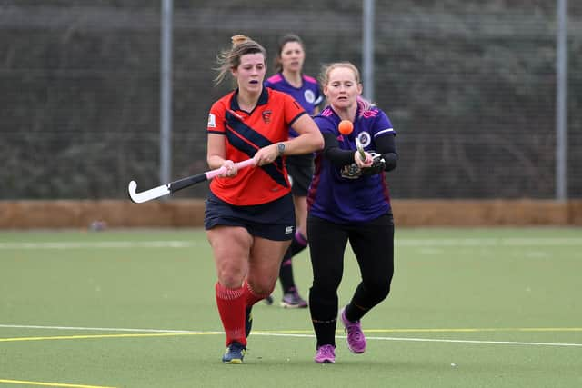 Portsmouth's Joni Duffus, right, in action against Trojans 4ths. Picture: Neil Marshall