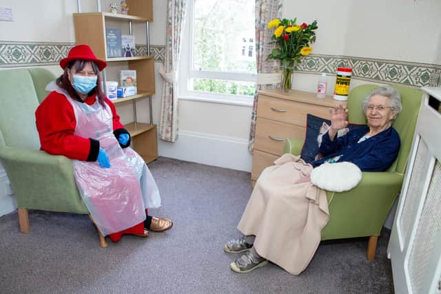 Jennifer Holland, 71, and mother Maisie Hider, 94, were able to chat and sing during the 20 minute indoor meeting.

Picture: Habibur Rahman