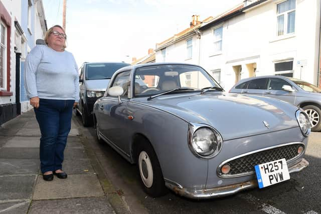 Louise Purcell, 56, of Adames Road, Fratton, are becoming frustrated after a vintage car has been parked in their road for two years
Picture: Sarah Standing (191022-4919)