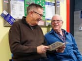 Resident Malc Wooldridge (right) discusses Pompey’s past with Alan Knight MBE on the ex-Fratton Park seats in their football corridor at Admiral Jellicoe House. / Picture by Sam Taylor.