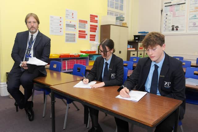 Headteacher Stewart Vaughan of Priory School in Southsea, said a number of his staff were vaccinated last week through the scheme.

Pictured is: Head girl and head boy at Priory School Ava Errington-Noden (15) and Ethan Bailey (15) with headteacher Stewart Vaughan.

Picture: Sarah Standing (131120-8549)
