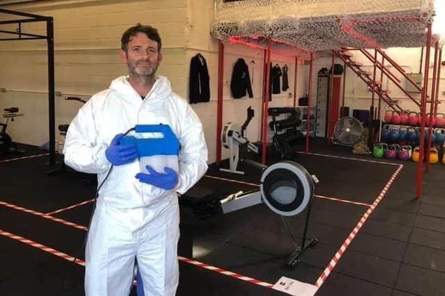 Simon Poland, of Portchester, pictured deep cleaning Renegades Gym in Copnor