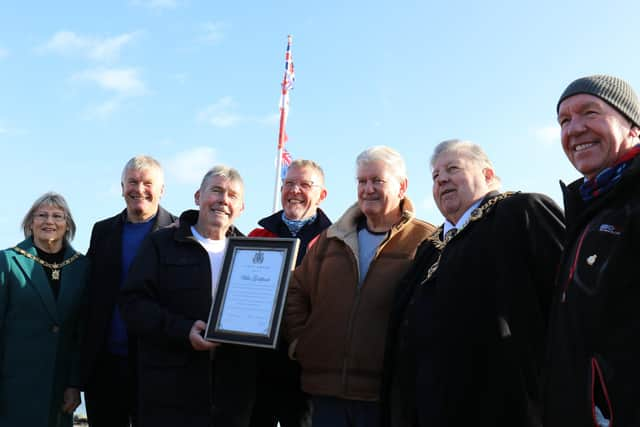 Willie Goldfinch, centre, receiving a civic award for his work setting up and tending to the Peoples' Memorial in Portsmouth. Photo: Phix-Pix Photo and Graphic Solutions www.phix-pix.com