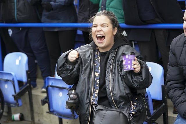 This fan is clearly enjoying Colby Bishop scoring from the penalty spot in front of the Fratton End.