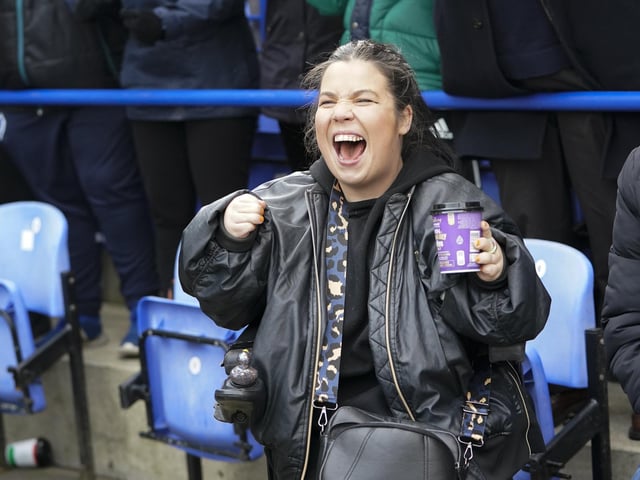 This fan is clearly enjoying Colby Bishop scoring from the penalty spot in front of the Fratton End.
