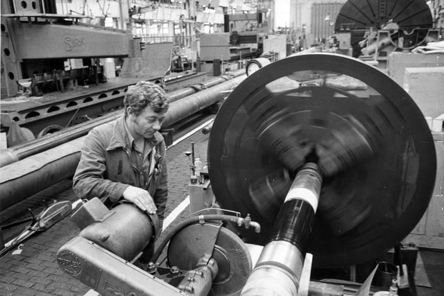 Portsmouth Naval Base workers operating their machinery in 1975. The News PP5003