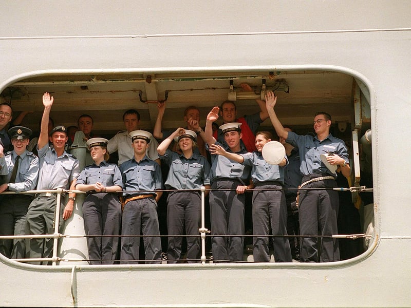 Crew members on HMS Invincible wave to their gathered famillies as the great ship docks in 1999.
Picture: Pete Langdown. The News 992543-2