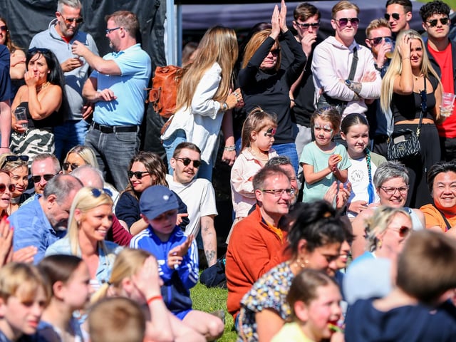 The chilli eating contest drew large crowds as the contestants eat multiple spicy chillis